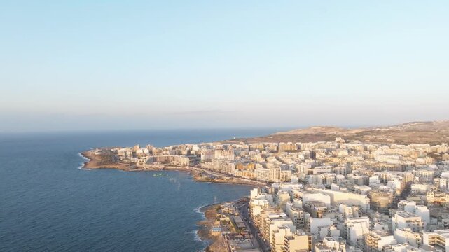 Dense City At Saint Paul's Bay Waterfront On Maltese Island. Aerial Drone Shot