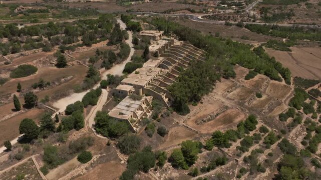 Festival Hotel - Ruined Hotel On Marfa Ridge Near Mellieha Bay In Mellieha, Malta. aerial orbiting shot