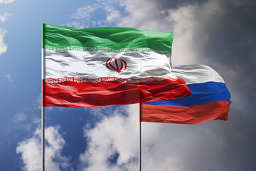 Flags of Iran and Russia above blue sky