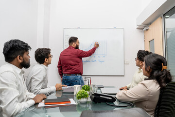 Businessman Presenting New Corporate Strategy, Instructor Drawing and Writing Plan on Whiteboard,...