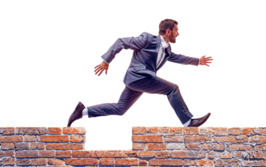 Leap of Faith:  A determined businessman in a sharp suit leaps over a brick wall, symbolizing overcoming obstacles and achieving goals. This powerful image embodies ambition, perseverance.