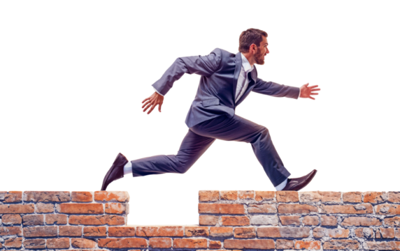 Leap of Faith:  A determined businessman in a sharp suit leaps over a brick wall, symbolizing overcoming obstacles and achieving goals. This powerful image embodies ambition, perseverance.