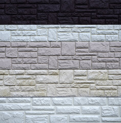 plastic panels with a pattern of blocks or bricks for finishing facades of buildings. assortment, choice of finishing materials.