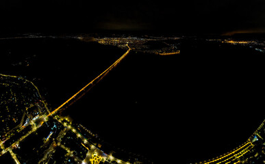 Saratov, Russia. Lights of the night city. Saratov bridge. Embankment of the Volga River. Aerial view