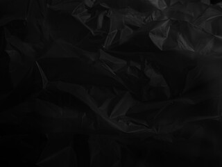Abstract background plastic bag black vacuum cling foil wrinkle texture wall crumpled film foil overlay seal wrap polyethyene packaging frame material industry wrinkle template ecosystem environment
