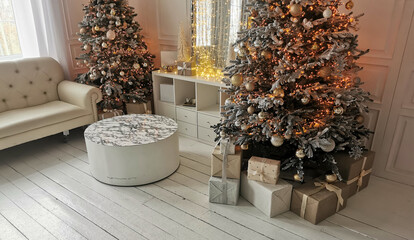 Beautiful holdiay decorated room with Christmas tree with presents under it