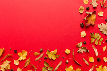 Autumn composition. Pattern made of dried leaves and other design accessories on table. Flat lay, top view