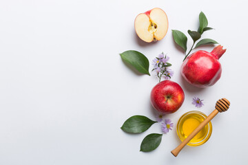 Flat lay composition with symbols jewish Rosh Hashanah holiday attributes on colored background, Rosh hashanah concept. New Year holiday Traditional. Top view with copy space