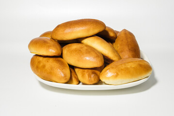 Pies made with homemade dough. Close-up on a white background
