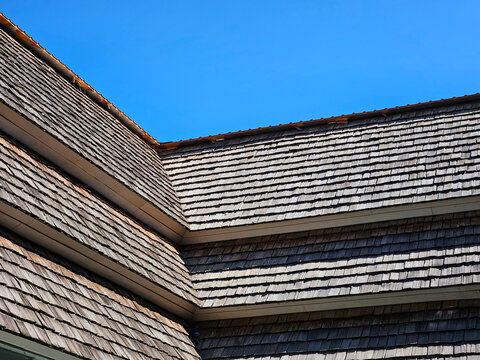 Layer of Northern Thai wooden roof with blue sky pattern and texture background
