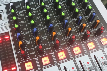 audio control. Audio technicians use mixing consoles, remote controls to adjust sound, audio...