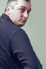 Businessman turning around looking suspicious