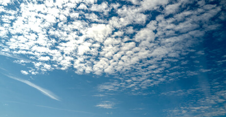 Spring blue sky cloud gradient background. Cloudy sky. Vivid cyan blue landscape in environment day horizon skyline view. White clouds on soft sky background. White cloudy sky.