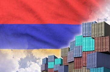 Armenia flag and big stack of shipping cargo containers in docks with sky background close up