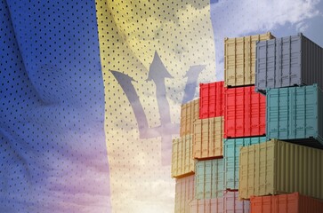 Barbados flag and big stack of shipping cargo containers in docks with sky background close up