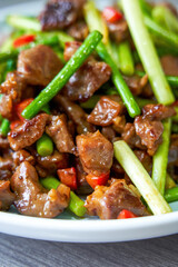 A delicious Chinese home-cooked dish, stir-fried beef with garlic sprouts