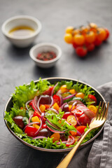 Easy vegetarian salad of fresh cucumber, tomato, sweet pepper, radish and onion . Healthy food.