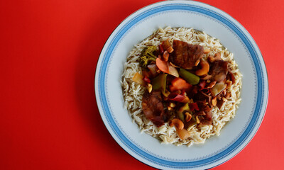 Delicious Malaysian style duck with vegetables and steamed rice.
