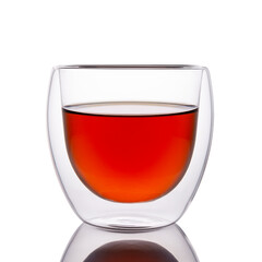 Tea in a transparent glass isolated on a white background. Glass goblet with double walls. Thermal glass with tea.