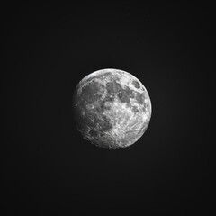 Obraz premium Close up view of a night full Moon reveals its rugged terrain, with craters, mountains, and valleys