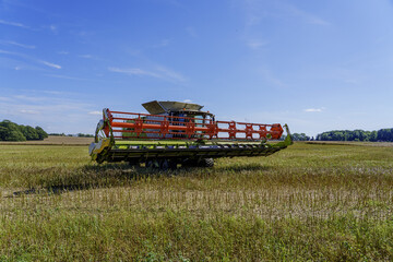 combine harvester working in a field