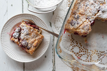 Piece of delicious sweet casserole with cherries. Delicious german summer dessert called Kirschen Michel