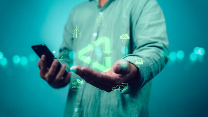 Circular economy concept for environmental sustainability, Human is holding a recycling symbol representing reuse and saving natural resources in the future, Bio Circular Green Economy concept.