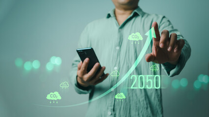 Carbon reduction and carbon credit to limit global warming from climate change, Businessman point to increasing arrow with carbon reduction for decrease CO2, Bio Circular Green Economy concept.