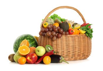 Many different fruits and vegetables in wicker basket isolated on white