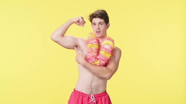 A young man shows off his biceps