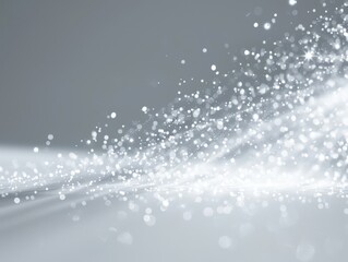 Obraz premium Soft, ethereal particles of light shimmer gently in a calming gray atmosphere