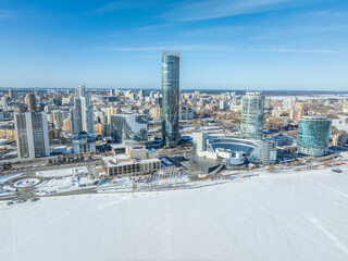 Yekaterinburg city with Buildings of Regional Government and Parliament, Dramatic Theatre, Iset Tower, Yeltsin Center, panoramic view at winter sunset.