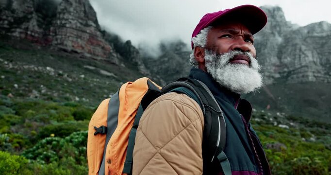 Senior man, backpack and hiking in mountains with trekking, adventure and path search in nature. Outdoor, camping and travel with retirement vacation and African person with doubt of direction