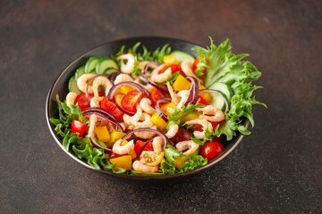 Easy  salad of fresh cucumber, tomato, sweet pepper, shrimps and onion . Healthy food.