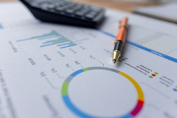 business financial accounting documents with charts growth, keyboard and pen. workplace,