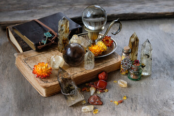 gemstone crystals, amulets, witchcraft items, spell books on wooden table. wiccan Witchcraft, crystal magic, Esoteric Ritual. spiritual practice for relax, meditation