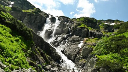 Waterfall in the mountains in summer. Siklawa Falls.