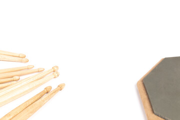 Percussion training elements, Drumsticks and practice pad isolated on white.