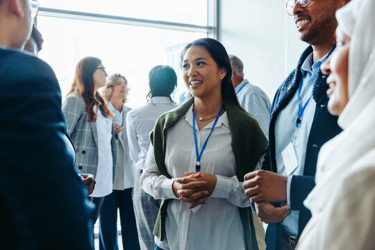 Diverse business professionals networking at a conference event