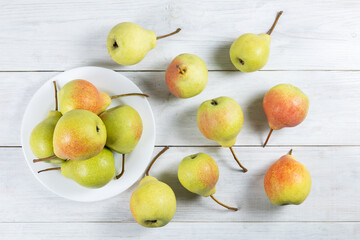 Fresh pear fruit on plate with white table, Healthy fruit