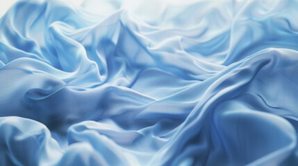 Obraz premium Delicate, flowing blue fabric captured in soft light resembles the gentle waves of a serene ocean.