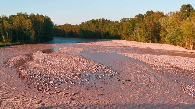 flood of the Enza river in Montecchio Emilia Italy at sunset. High quality 4k footage