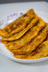 Close-up of a plate of delicious fried egg dumplings