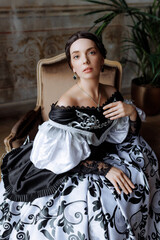 A caucasian woman, mid-30s, exudes aristocratic grace in a richly embroidered Baroque gown. Ideal for fashion editorials, historical romance book covers, or interior design concepts.