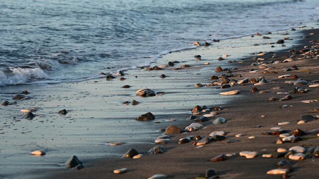 Waves crashing on the pebble beach.
