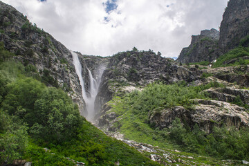 Shdugra waterfall with neighbour waterfalls near Village Mazeri, Svaneti. Expedition in Forest nearby Ushba Mountain.Shdugra waterfall near Mazeri, Georgia.

