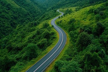 Aerial view asphalt road on green forest, Curve asphalt road on mountain green forest, Countryside road passing green forrest and mountain , ai