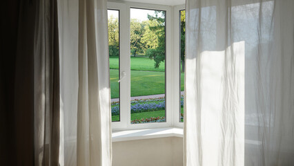 View from the window, green trees, landscape with flower.      