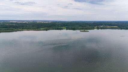 Drone photography of forest and lake during summer day