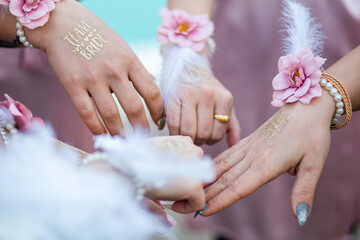 Close-up of Bridesmaids' Hands Adorned for Wedding Day
